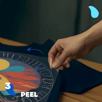 Step 3 - Peel: Peeling the clear carrier film off the t-shirt to reveal the finished design.
